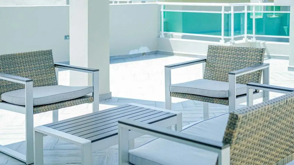 Chairs and table on the terrace at Beach Apartamentos at Playa Palmera Beach Resort